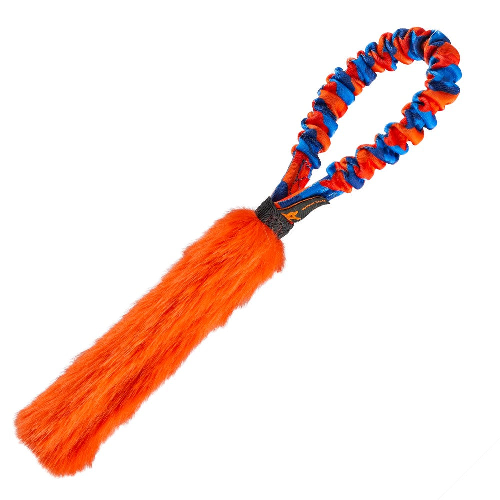A compact pocket sized tug toy for interactive dog training, with orange patterned bungee handle and orange faux fur.